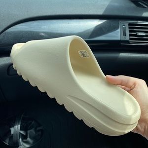 Authentic Yeezy slides in bone. Brand new with box. Just ordered the wrong size.